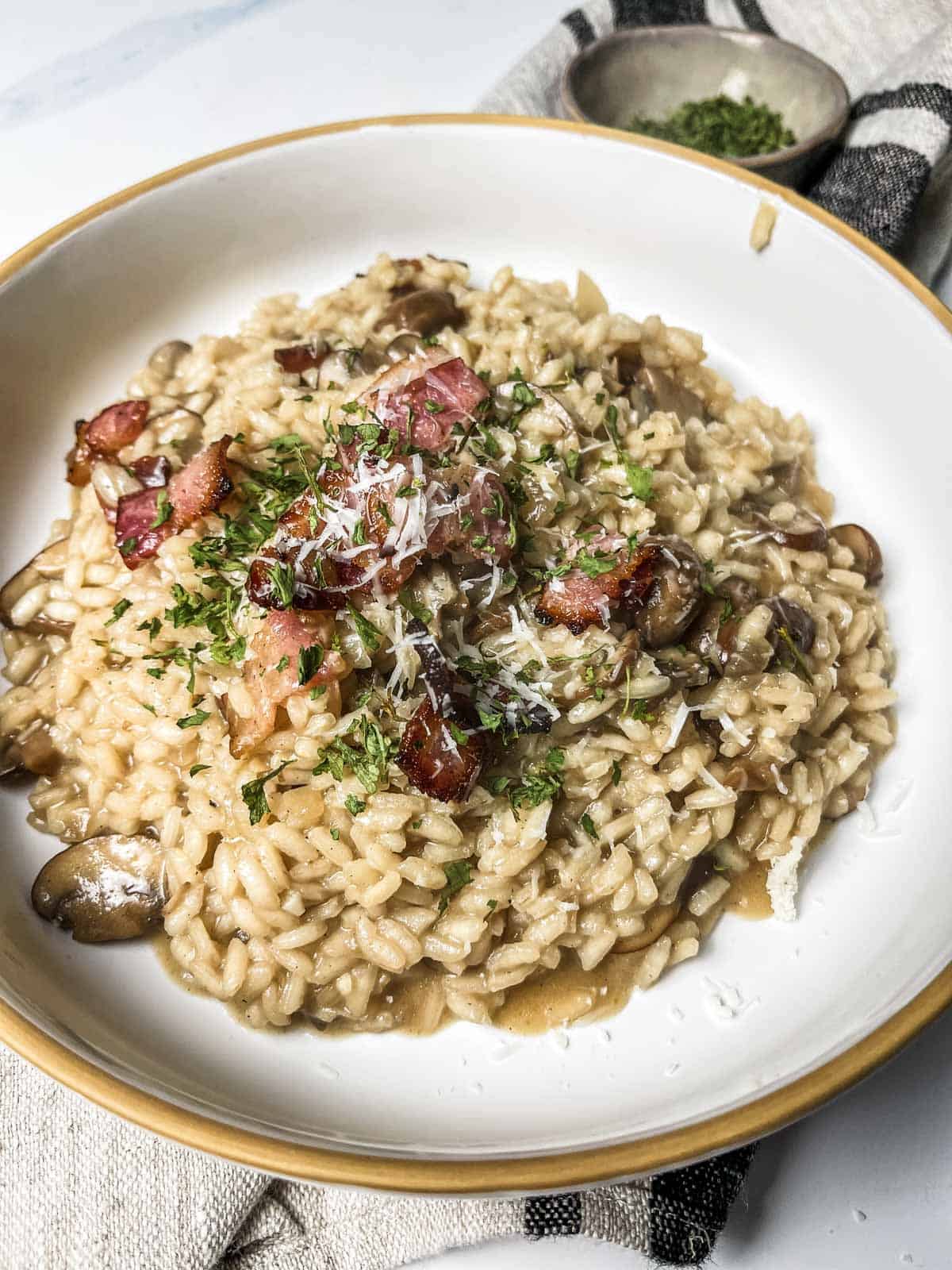 Bacon and mushroom risotto served.