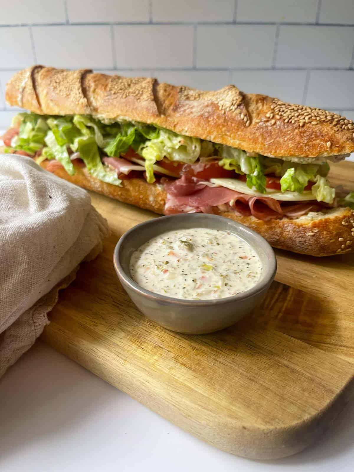 grinder sauce with sandwich. 