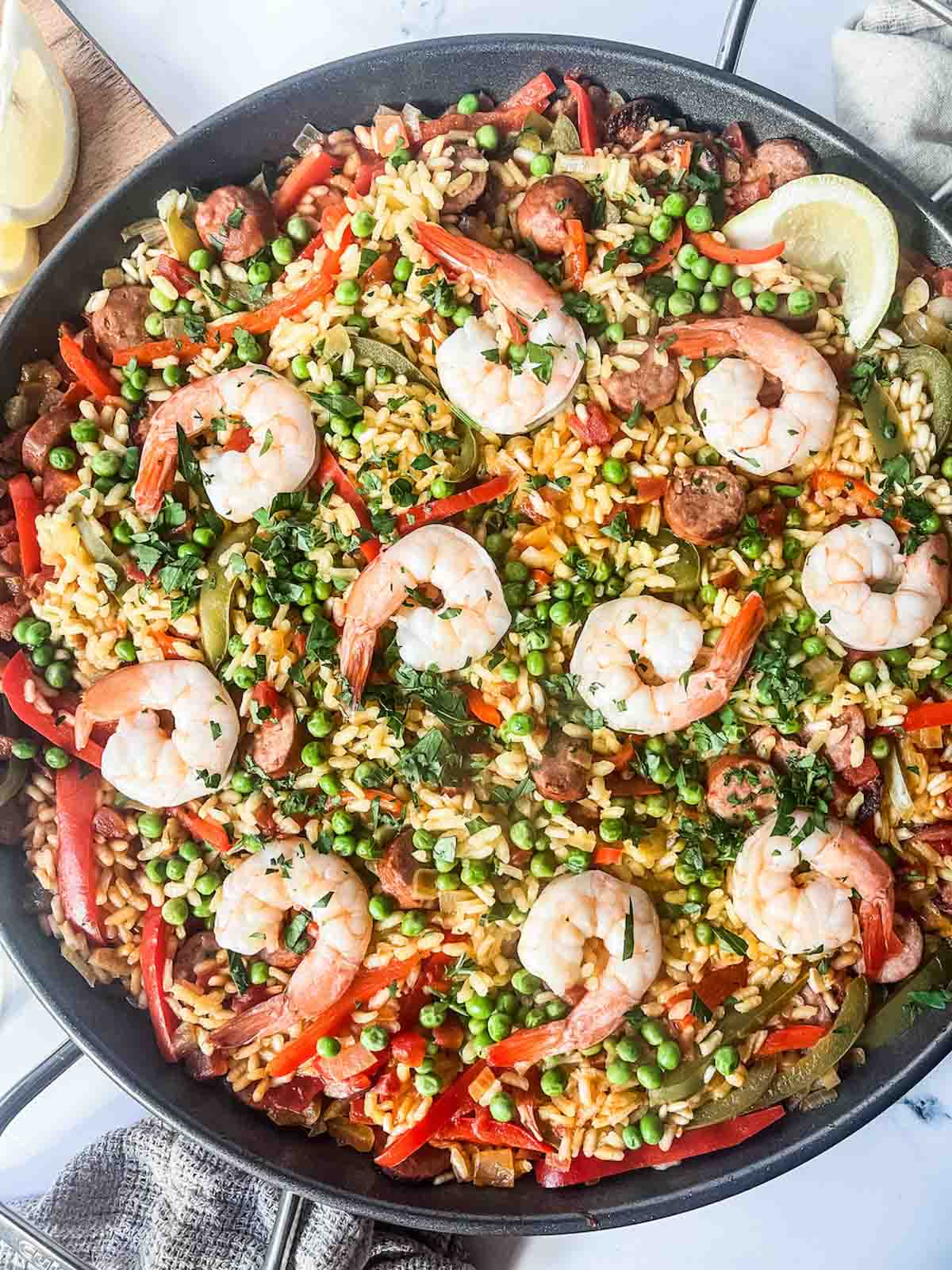 sausage and shrimp paella in pan. 