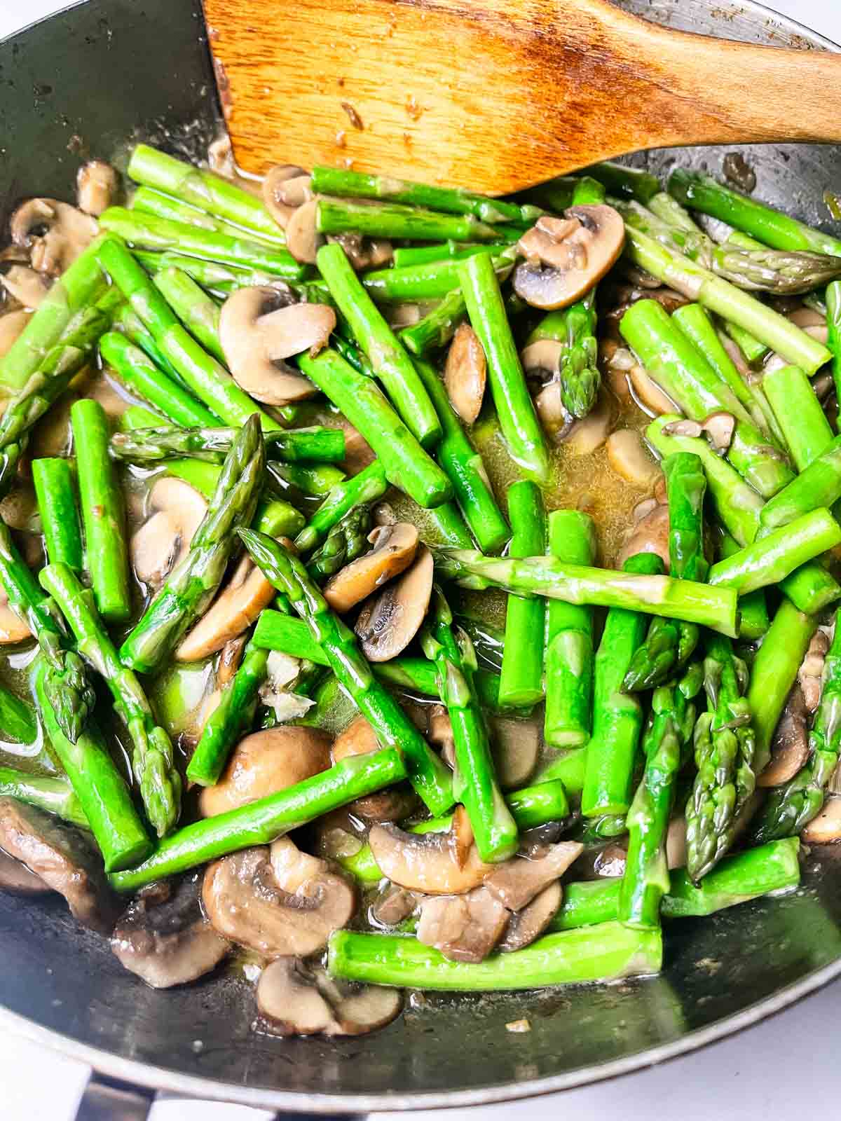 Chicken with Mushroom and Asparagus wine and broth added.