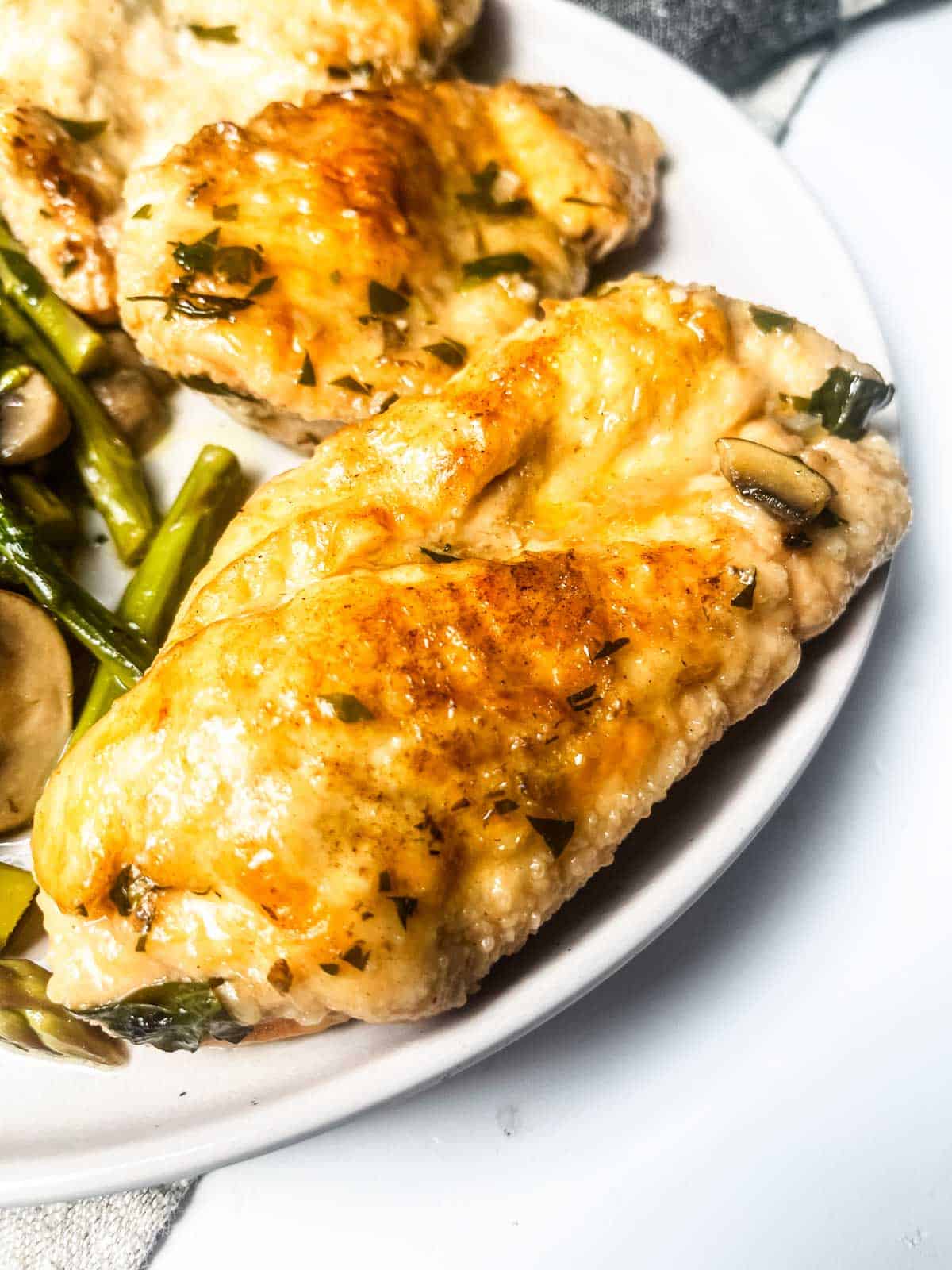 Chicken with Mushroom and Asparagus up close of chicken breast.