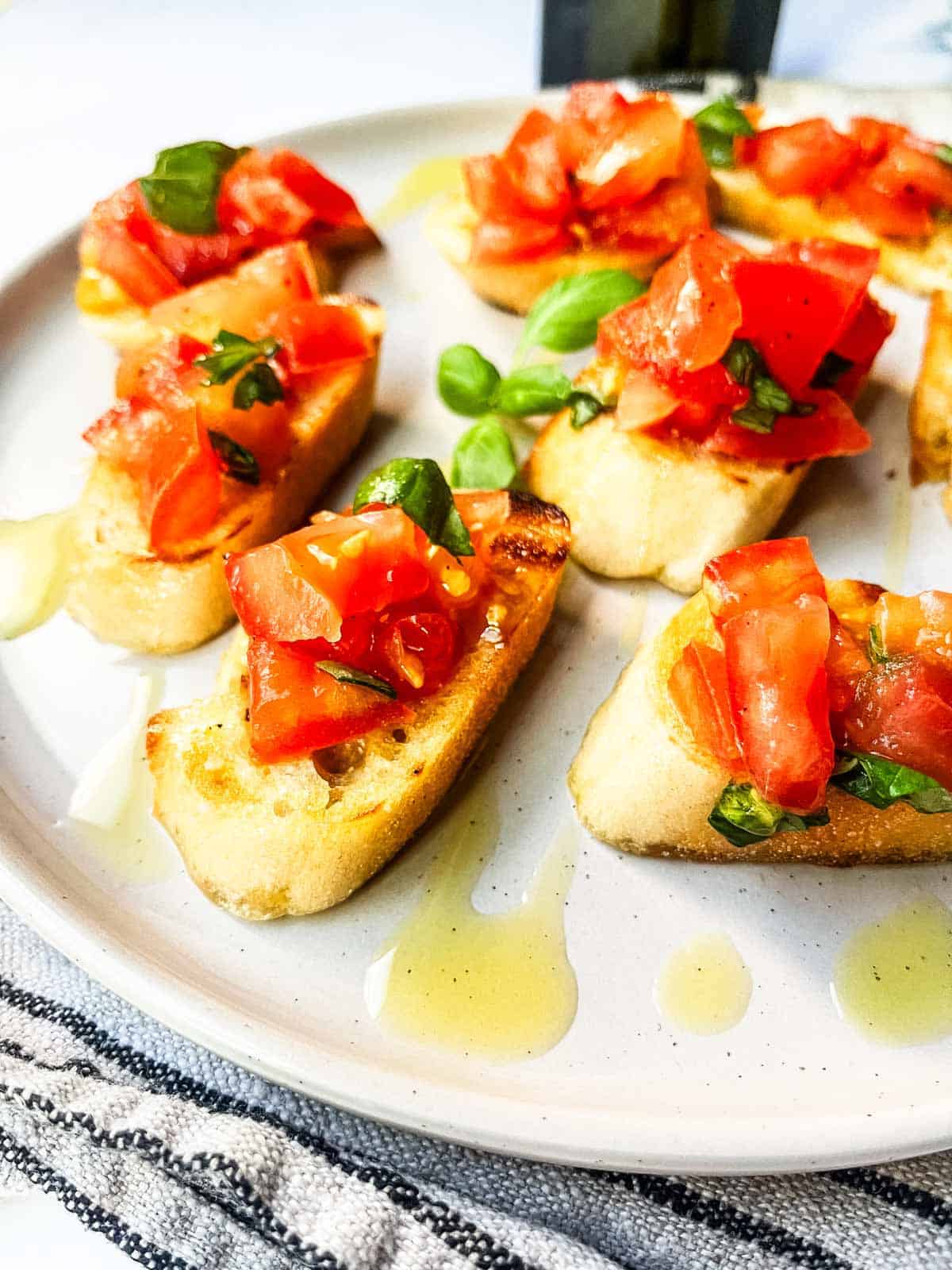 Grilled Bruschetta drizzled with olive oil.