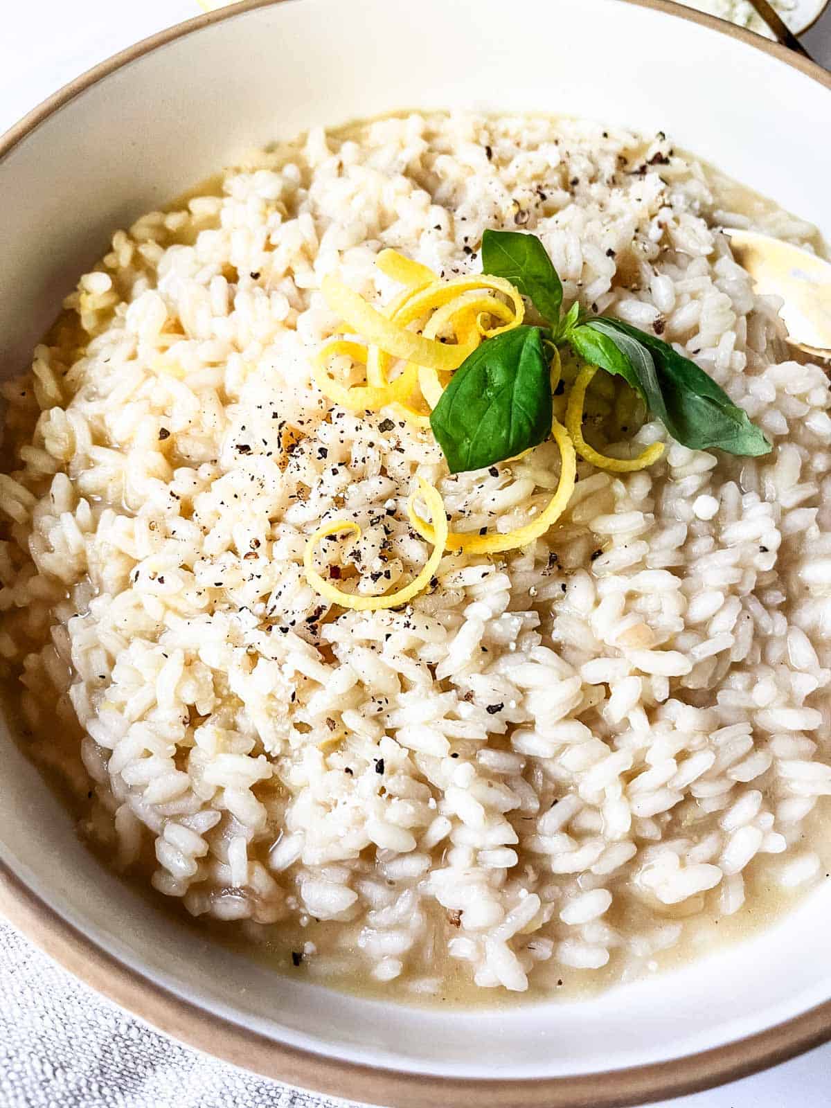 Risotto al Limone with lemon zest garnish.